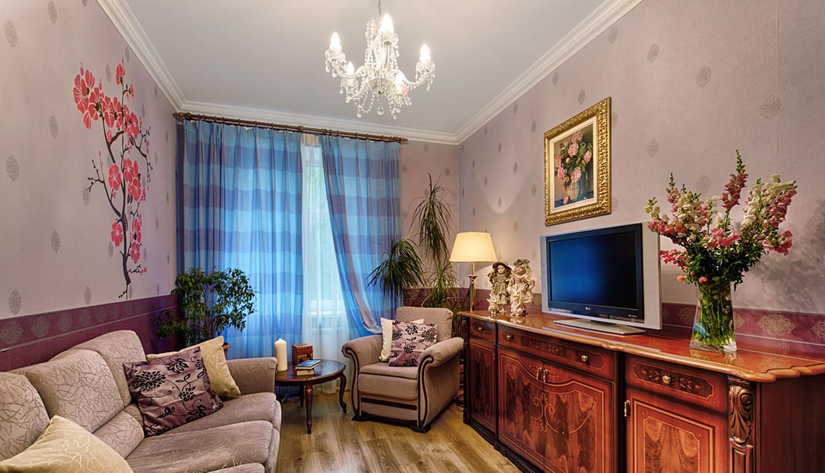 Sitting room with a corner sofa and blue check curtains