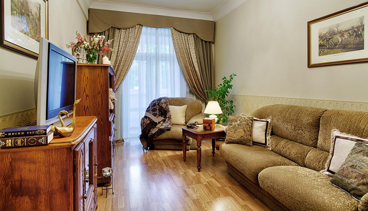 Olive-green sitting room with a sofa and a low table
